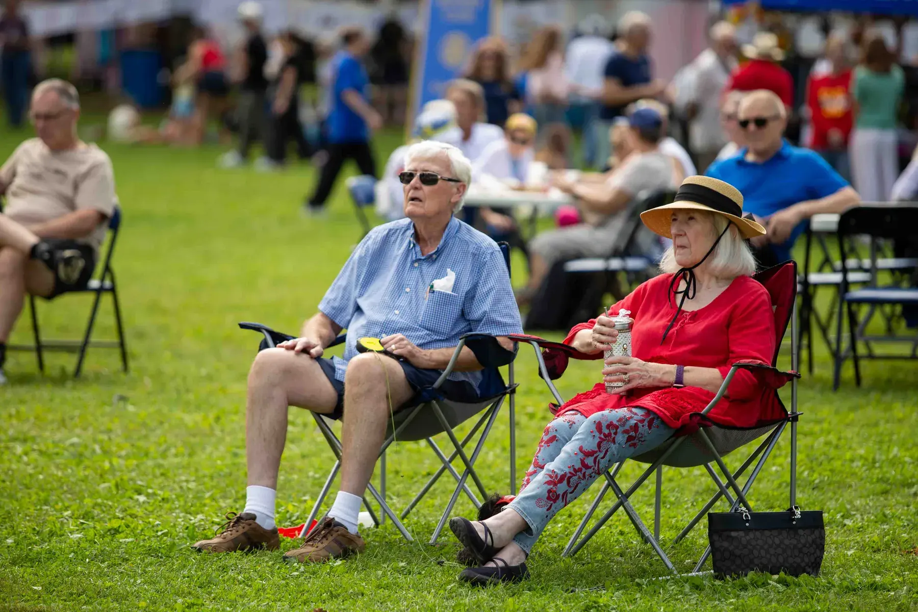 Guests relaxing in lawn chairs