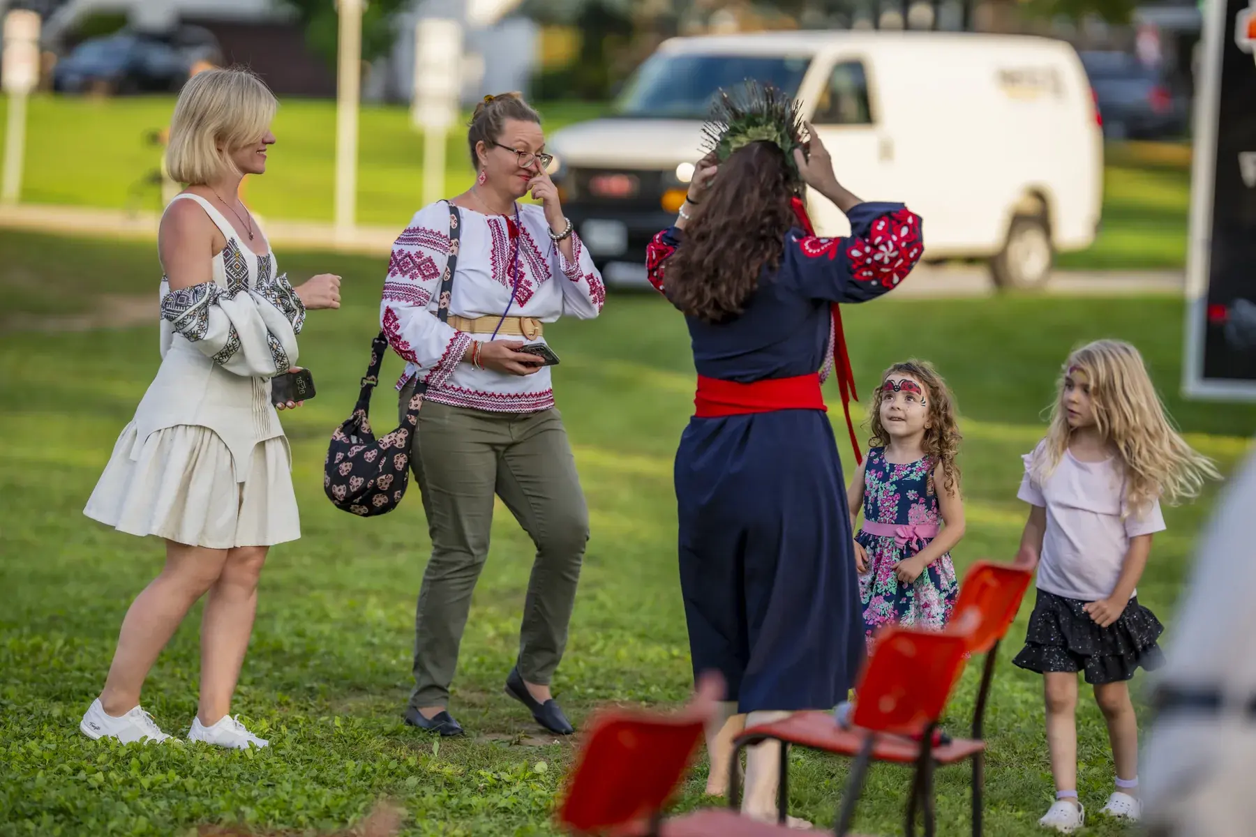 Yuliia Bobrovnyk at UAFest 2026 — Women in embroidered clothes and little girls gather on the grass (photo: Tim Skinner)