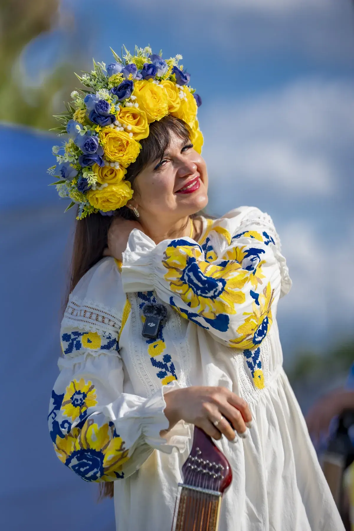 Lidiia Hurinenko at UAFest 2026 — Performer in a yellow-blue flower crown and embroidered dress on stage (photo: Tim Skinner)