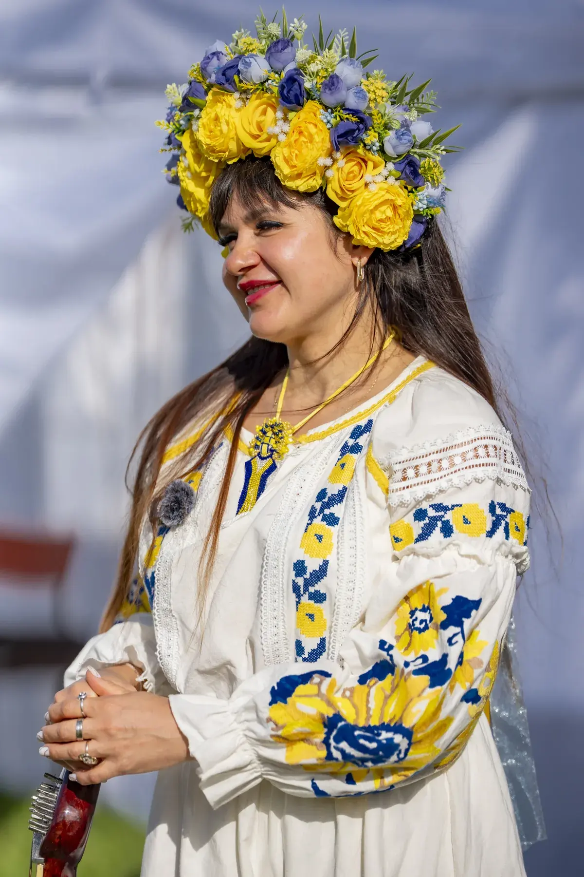 Lidiia Hurinenko at UAFest 2026 — Performer in a yellow-blue flower crown and embroidered dress on stage (photo: Tim Skinner)