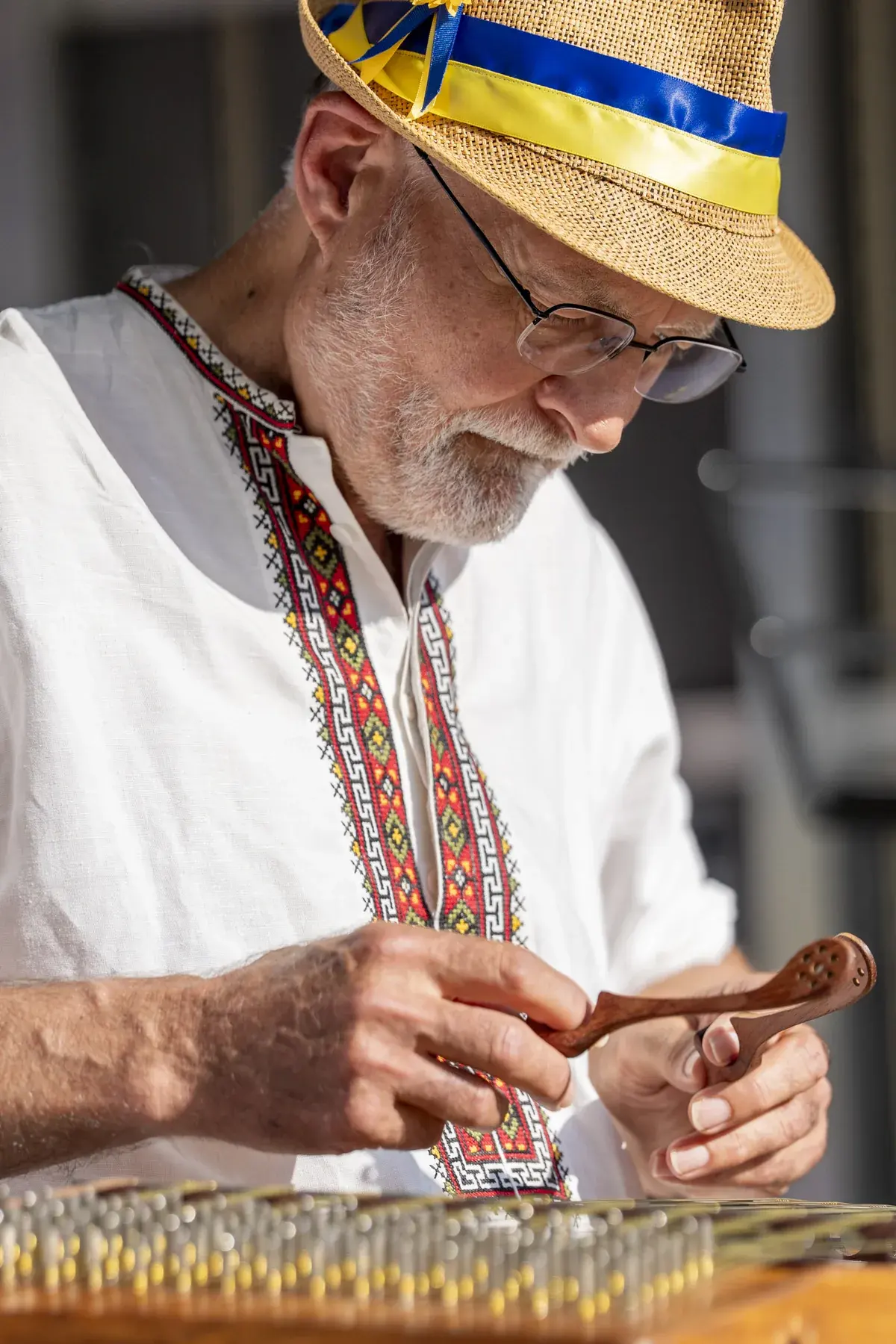 Roman Tykajlo at UAFest 2026 — Close-up of a cymbaly player's hands holding wooden hammers (photo: Tim Skinner)