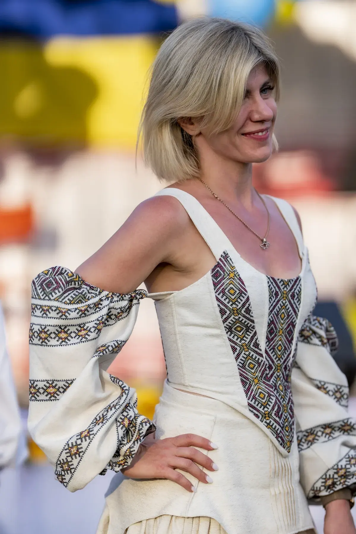 Svitlana Marchuk at UAFest 2026 — Woman in a cream corset dress with geometric embroidered sleeves poses (photo: Tim Skinner)