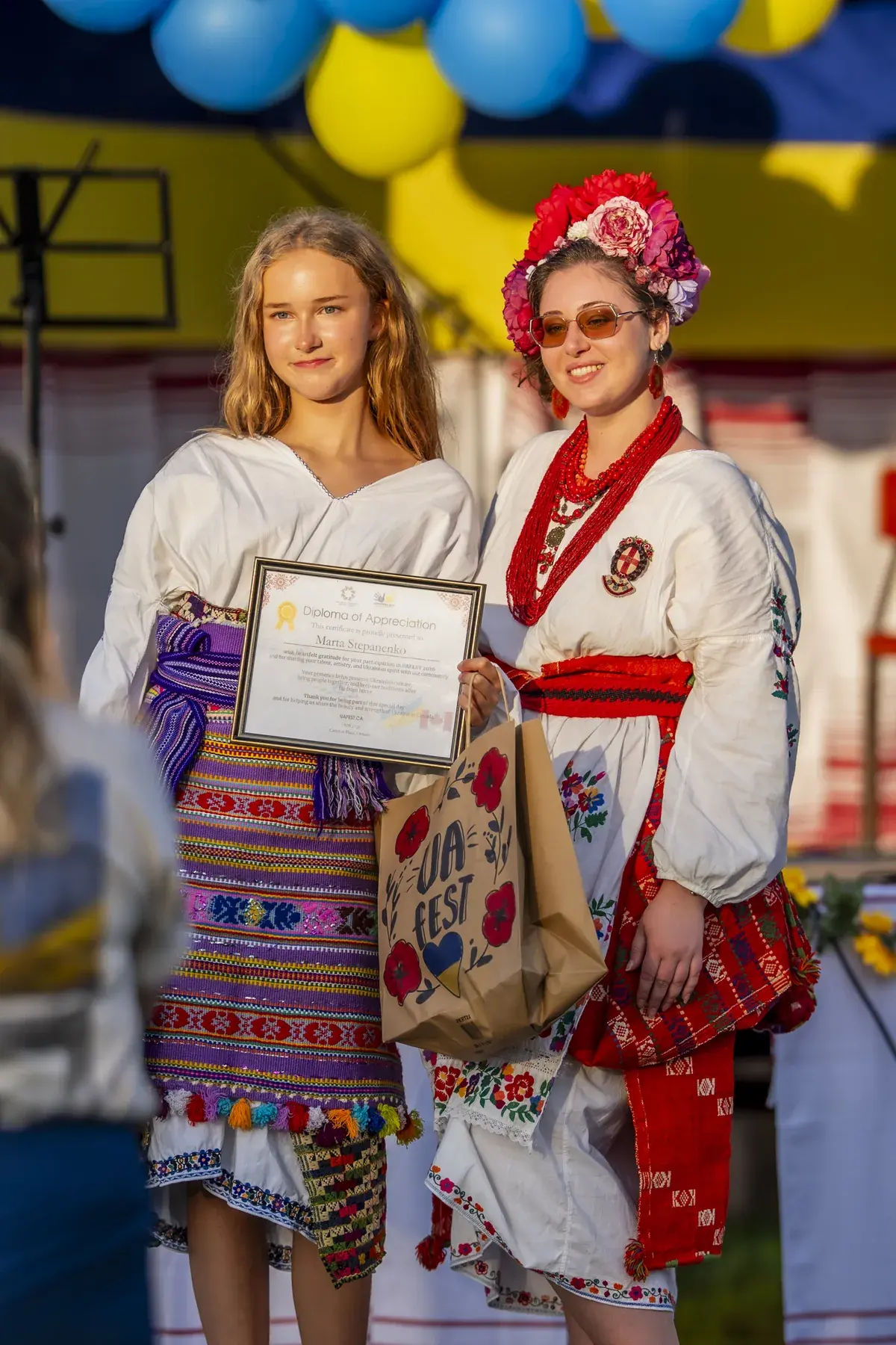 Marta Stepanenko at UAFest 2026 — Young singer receives a certificate of appreciation and UAFest gift bag (photo: Tim Skinner)