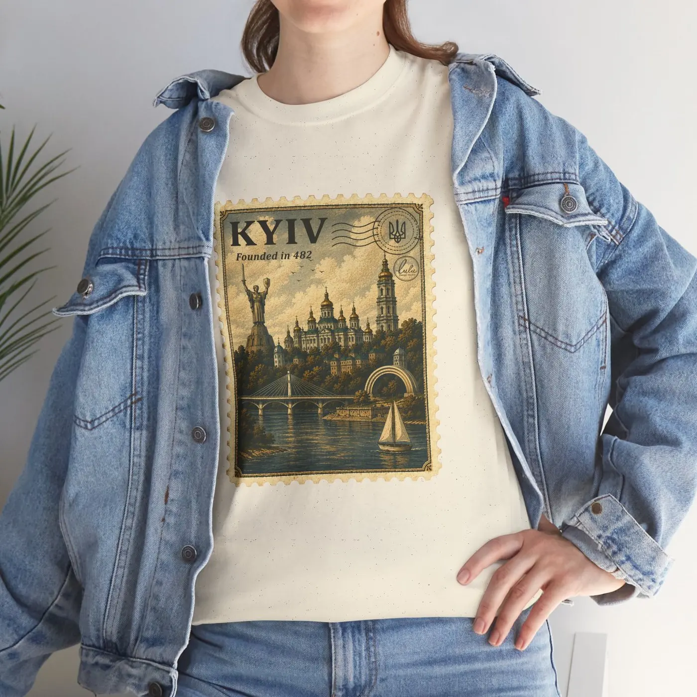 The Kyiv T-shirt worn under an open denim jacket