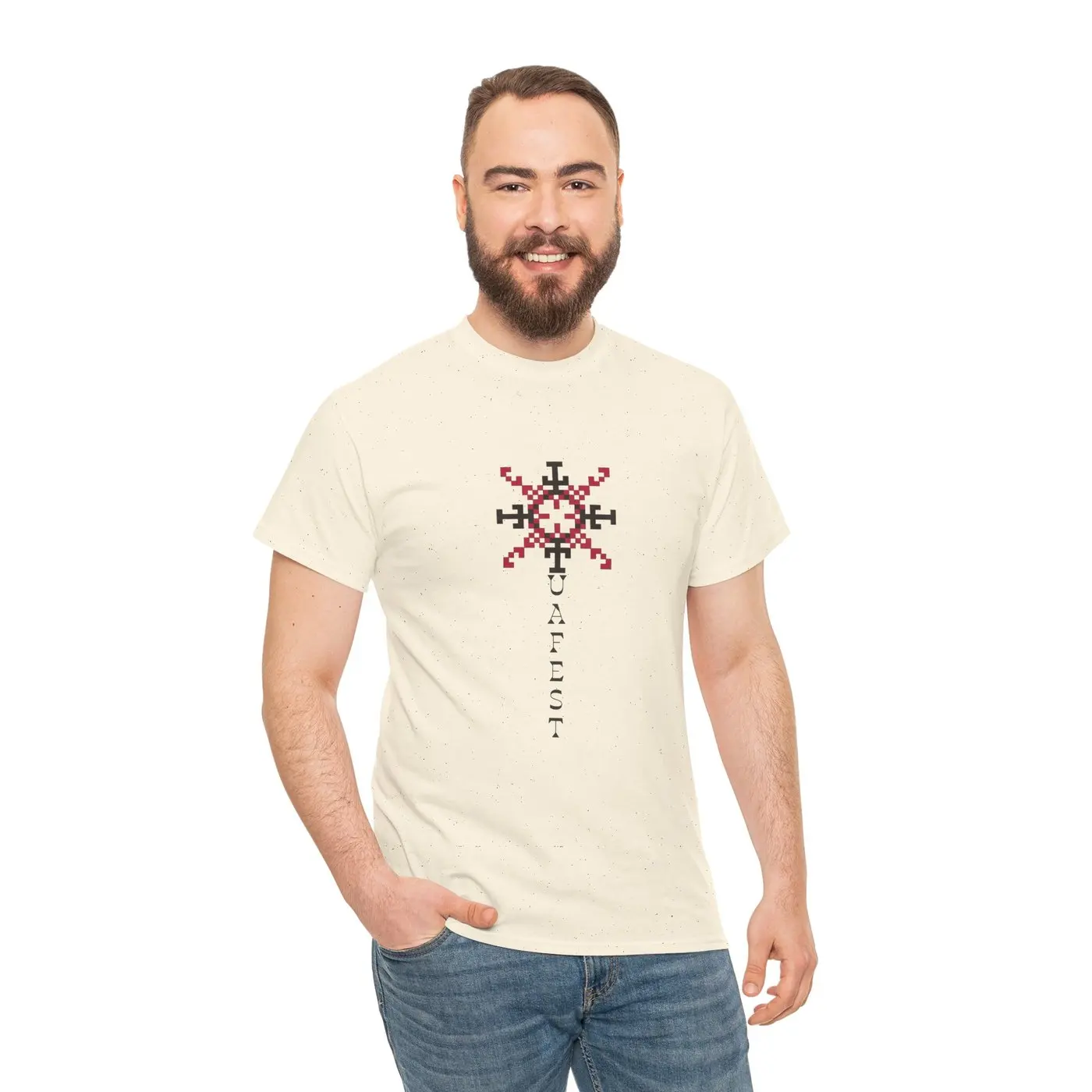 A man wearing the T-shirt, front ornament visible