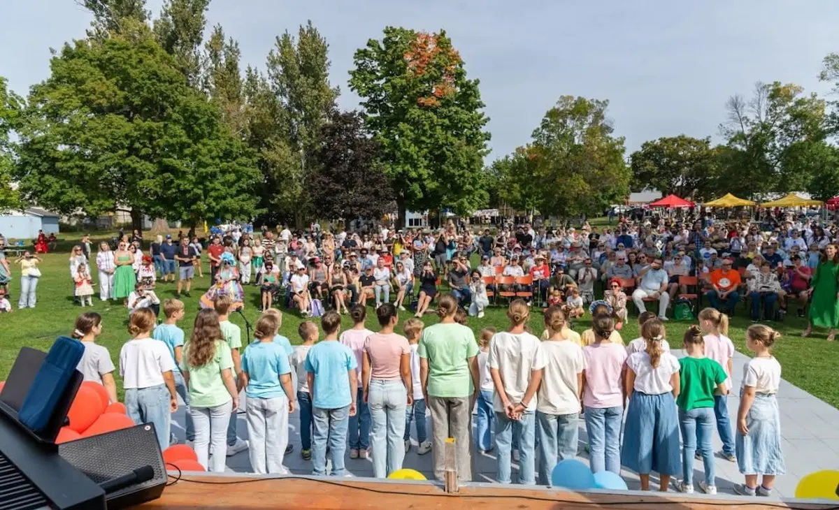 A large festival audience on the lawn at Riverside Park — the park UAFest aims to fill with 5,000+ guests in 2026