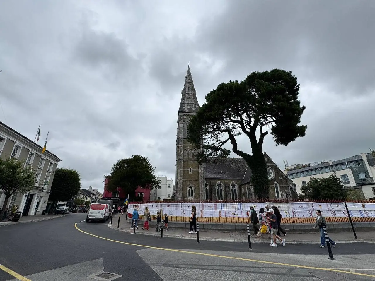 The rushnyk stretched the length of a street fence in front of a stone church