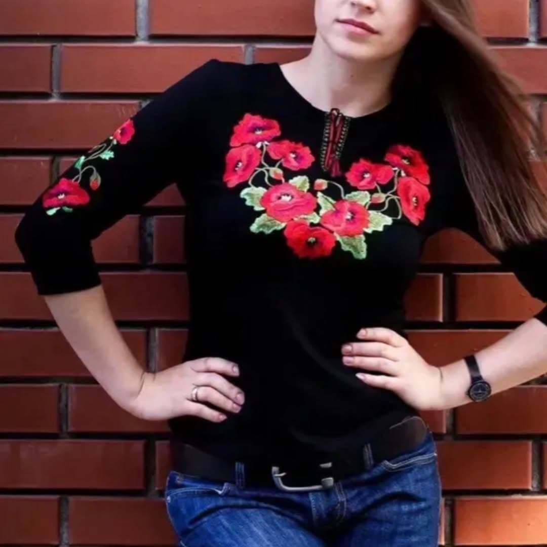 Black blouse with red floral Ukrainian embroidery presented by Eurostyle UA