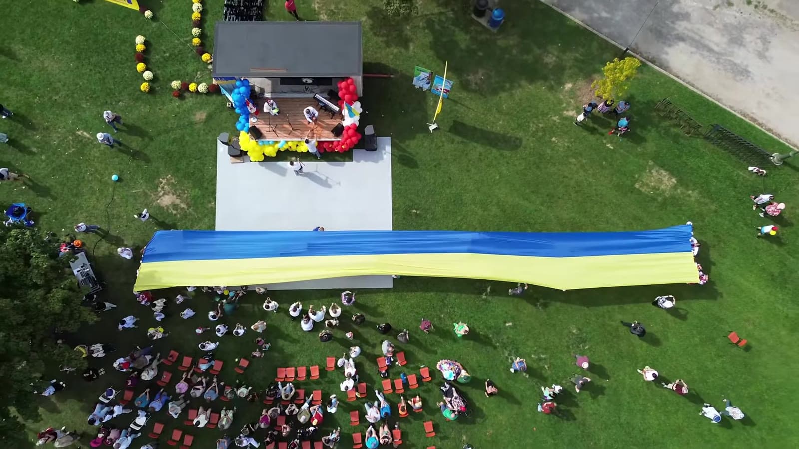 A giant Ukrainian flag carried over the crowd at the festival in Riverside Park, seen from above