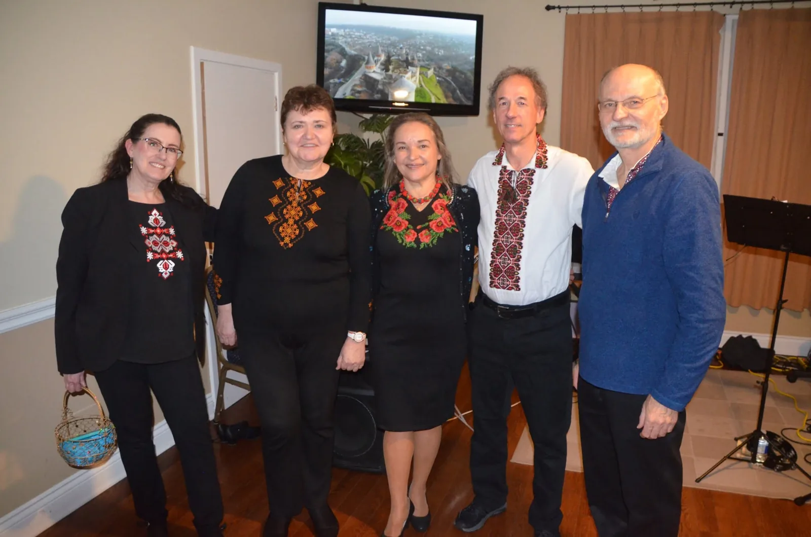 The five musicians of Dobryj Vechir Band in embroidered shirts: Bonnie, Larisa, Olya, Mykola and Roman