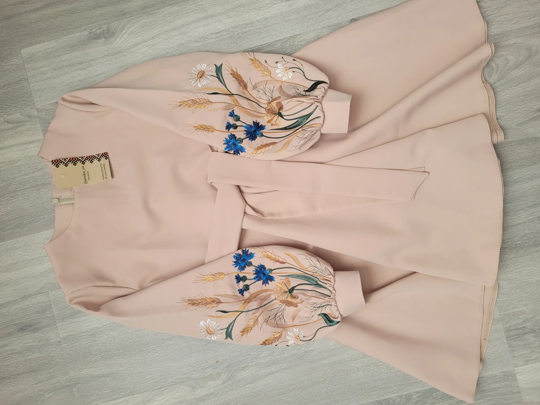 "Пшеничне поле" — a powder-pink girls' dress with machine-embroidered wheat ears and cornflowers on the sleeves