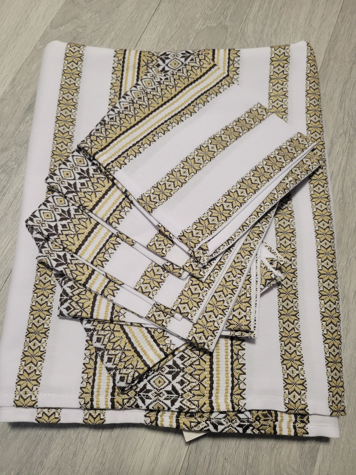 Ethno tablecloth "Волинянка" with six matching napkins, woven with a geometric ornament in gold and black on white