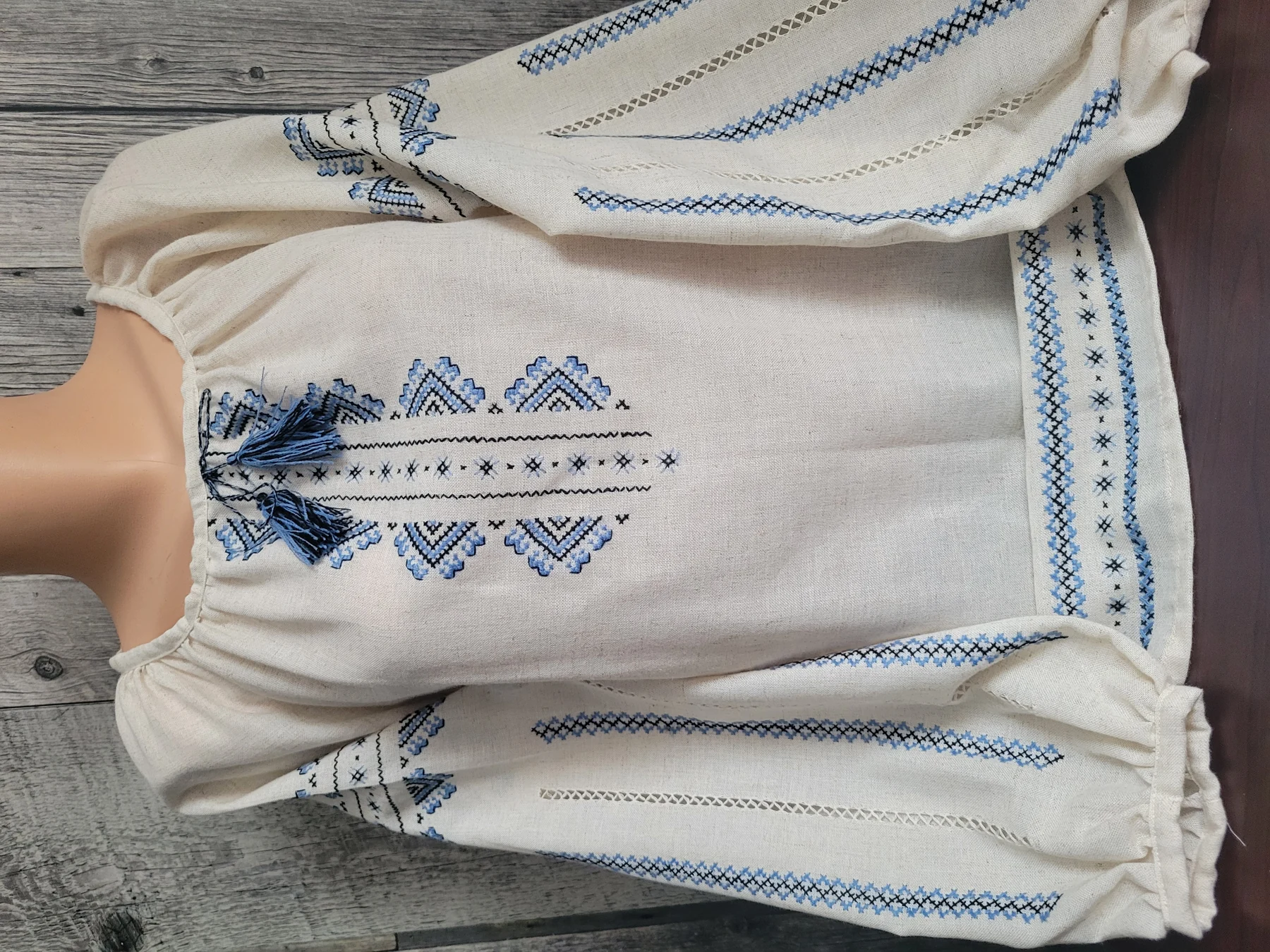 "Синій оберіг" — a linen women's vyshyvanka with blue hand embroidery and drawn-thread work on the sleeves