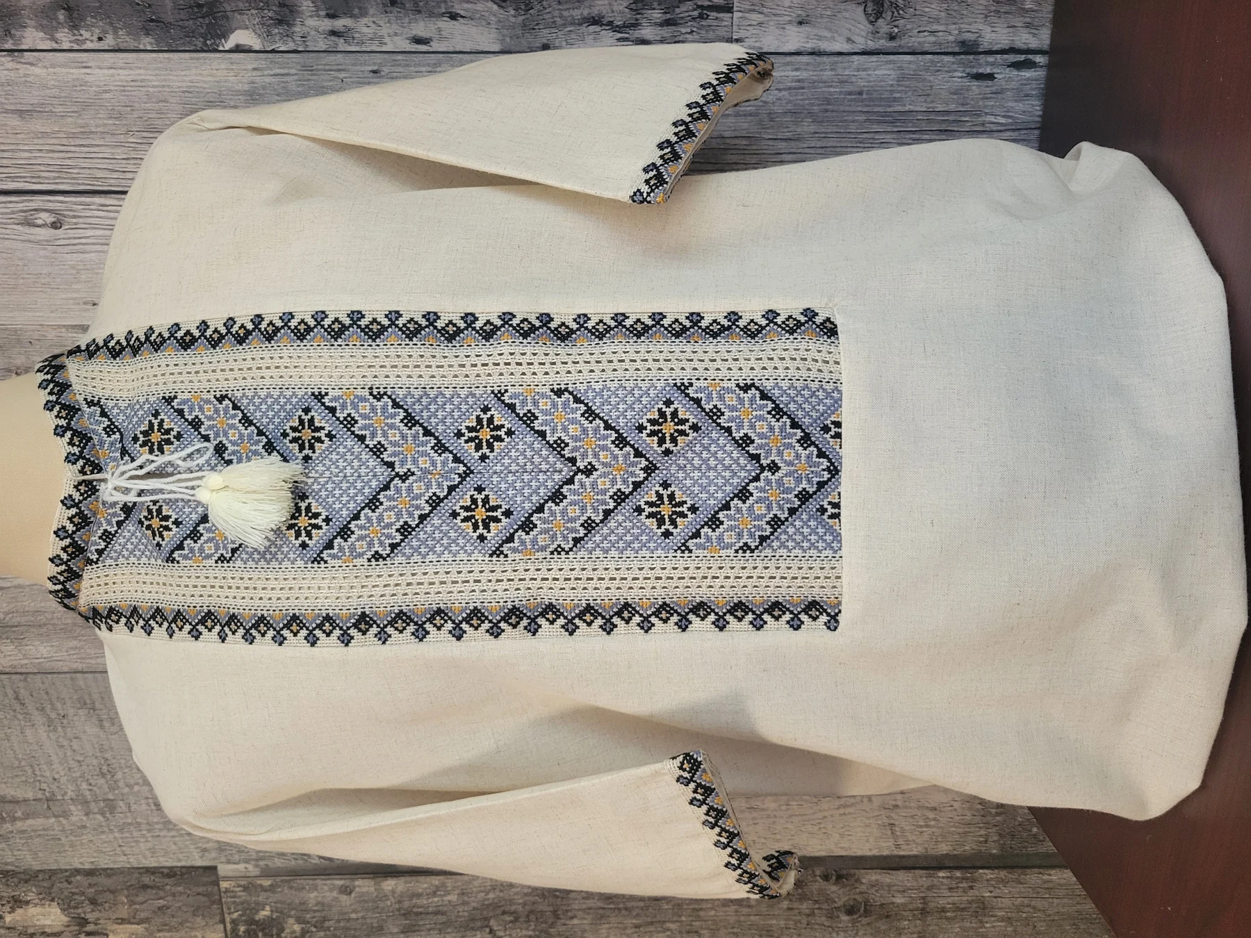 "Мудрість предків" — a men's shirt of natural homespun cloth with hand embroidery in black, blue and mustard