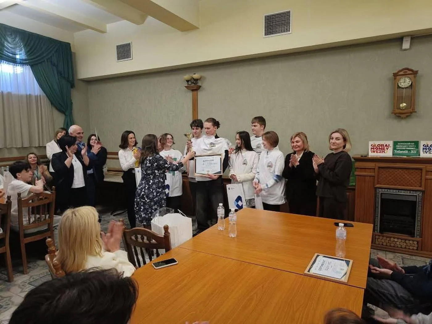 Trainers holding accreditation diplomas at the award ceremony of the Ukrainian national stage in Kyiv