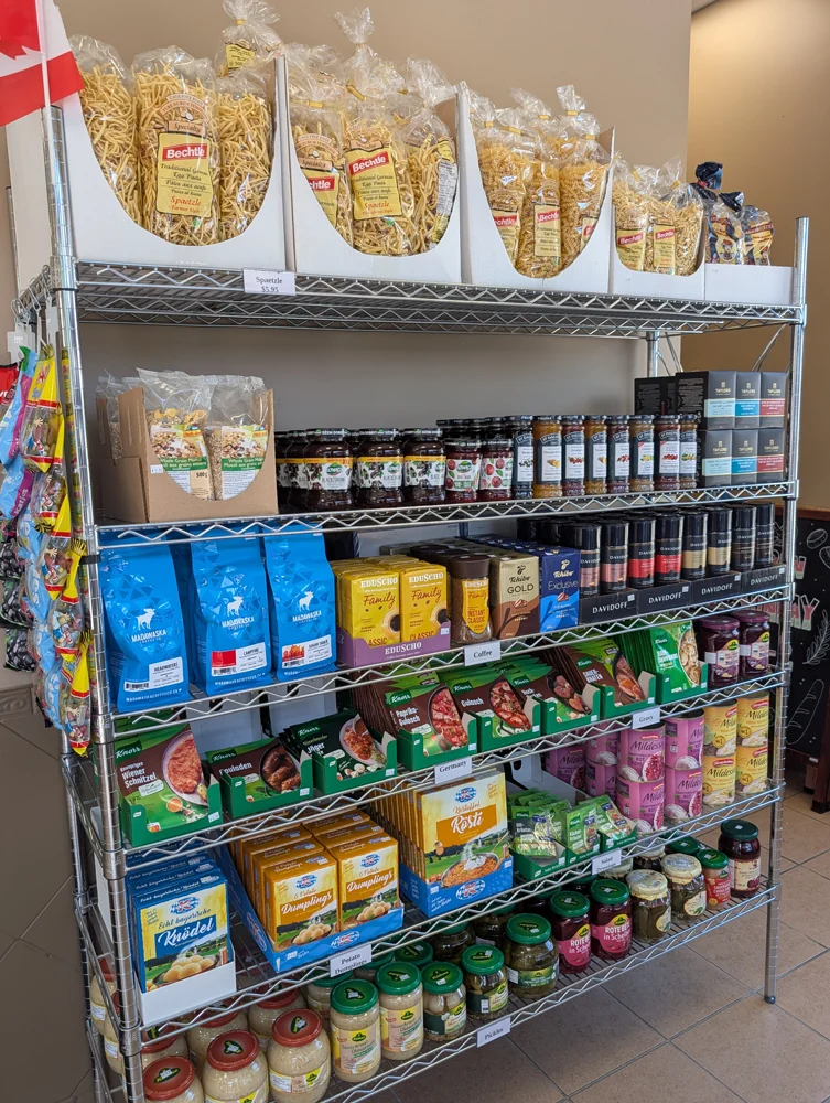The spätzle shelf: bags of Bechtle egg noodles above Knorr schnitzel, gulasch and rouladen mixes, Knödel and dumpling boxes, German coffees and jars of pickles.