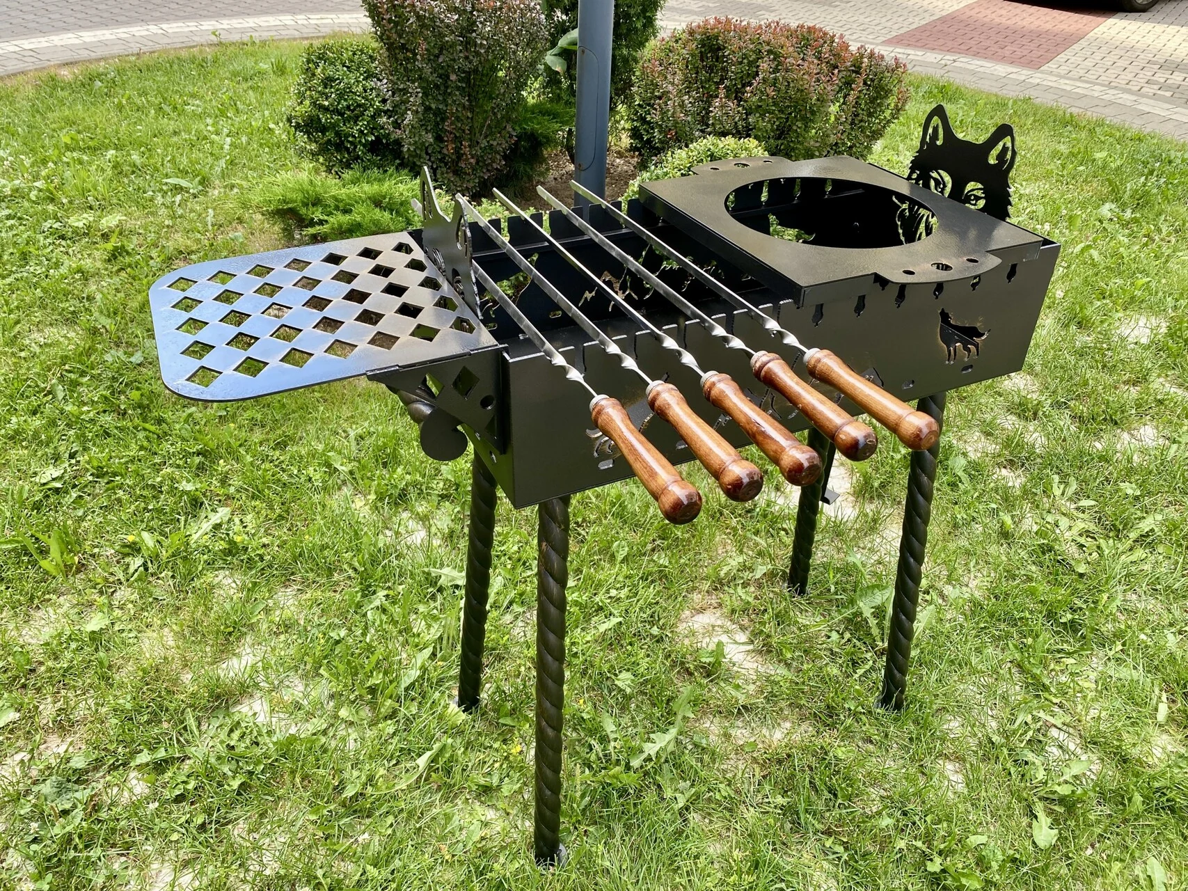 Mangal grill with skewers on the grass, from the Skrynka range