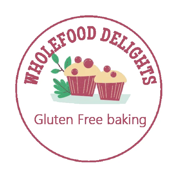 WholeFood Delights round logo — two cupcakes with berries and leaves, the words WHOLEFOOD DELIGHTS above and Gluten Free baking below