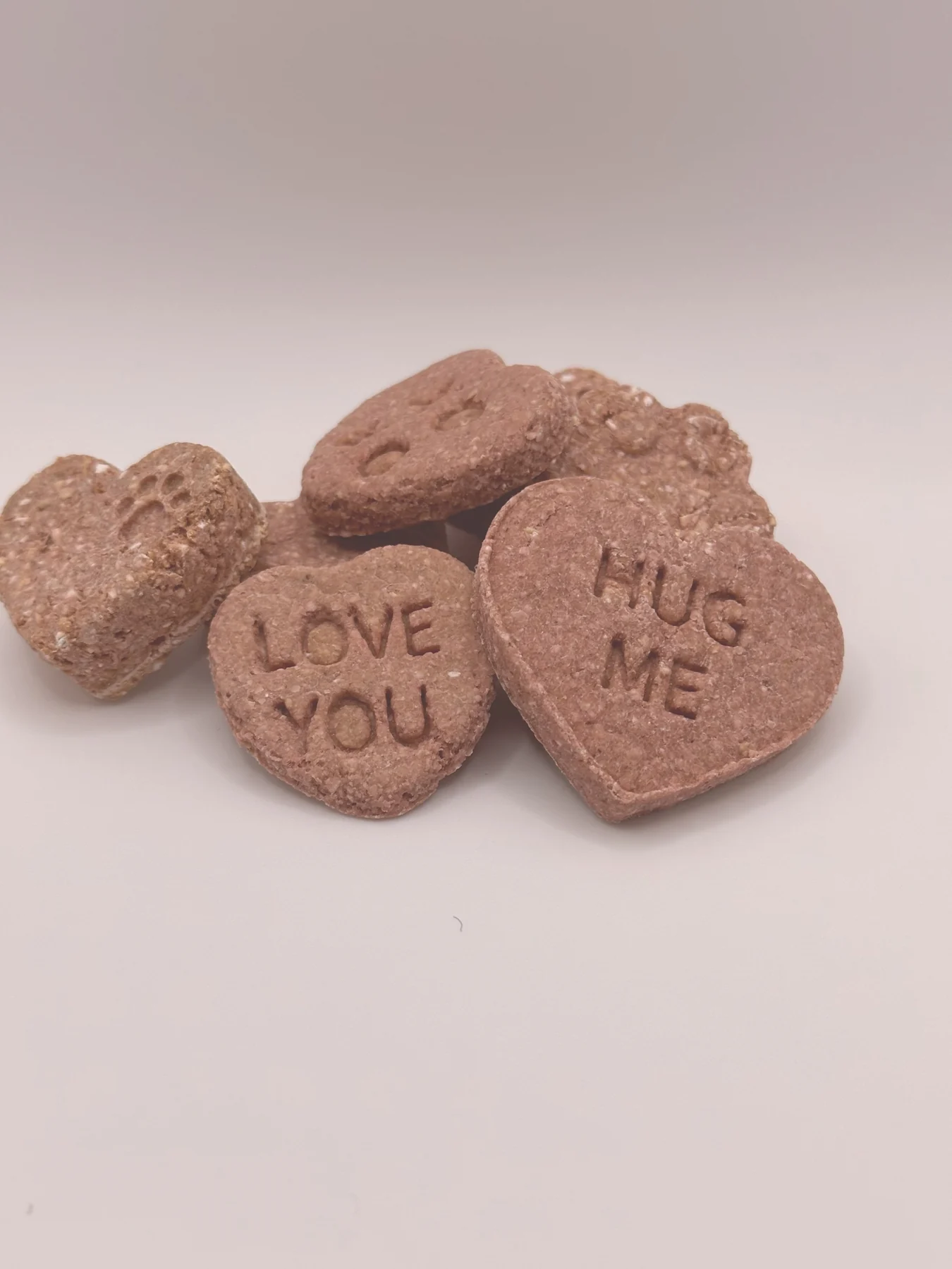 Heart-shaped Peanut Butter Biscuits stamped "LOVE YOU" and "HUG ME".